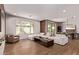 Comfortable living room with backyard views, modern fireplace, and open floor plan at 3128 E Tina Dr, Phoenix, AZ 85050