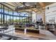 Community center lounge area featuring soaring ceilings, comfortable seating, and expansive windows at 3128 E Tina Dr, Phoenix, AZ 85050