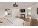 Spacious main bedroom with wooden floors, modern decor, and an attached bathroom at 3128 E Tina Dr, Phoenix, AZ 85050