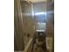 A compact bathroom with a shower and toilet at 318 N 83Rd Pl, Mesa, AZ 85207
