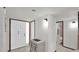 Inviting entryway features a white door, tile flooring, and a charming accent cabinet at 3345 E University Dr # 47, Mesa, AZ 85213