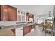 Open kitchen with dark wood cabinets, granite countertops, and stainless steel appliances at 3345 E University Dr # 47, Mesa, AZ 85213