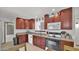 Well-lit kitchen featuring ample cabinet space, granite countertops, and modern appliances at 3345 E University Dr # 47, Mesa, AZ 85213