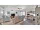 Open living room with tile floors, cozy seating, and a dedicated workspace at 3345 E University Dr # 47, Mesa, AZ 85213