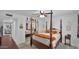 Inviting bedroom with a canopy bed, mirrored closet, and neutral decor at 3345 E University Dr # 47, Mesa, AZ 85213