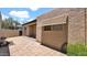 Neutral patio with stucco walls and brick pavers under a bright sky at 3345 E University Dr # 47, Mesa, AZ 85213
