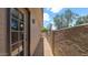 Covered patio with brick pavers along side of a neutral stucco home at 3345 E University Dr # 47, Mesa, AZ 85213