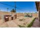 Backyard featuring a covered BBQ area, block fence and some landscaping at 3562 W Seldon Ln, Phoenix, AZ 85051