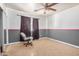 Empty bedroom with gray, pink and white walls, with a ceiling fan at 3562 W Seldon Ln, Phoenix, AZ 85051