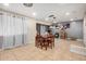 Versatile dining space with neutral tile flooring, and ample space for seating and storage at 3562 W Seldon Ln, Phoenix, AZ 85051