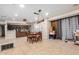Open dining area with tile floors, view of kitchen, and modern light fixture creates inviting atmosphere at 3562 W Seldon Ln, Phoenix, AZ 85051