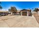 Charming single-story home featuring a tan exterior, tidy landscaping, and a single-car garage at 3562 W Seldon Ln, Phoenix, AZ 85051