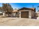 Charming single-story home featuring a tan exterior, tidy landscaping, and a single-car garage at 3562 W Seldon Ln, Phoenix, AZ 85051