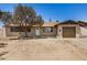 Charming single-story home featuring a tan exterior, tidy landscaping, and a single-car garage at 3562 W Seldon Ln, Phoenix, AZ 85051