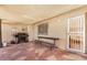 Covered patio featuring tile flooring, built in bench, BBQ and security door at 3562 W Seldon Ln, Phoenix, AZ 85051