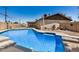 Backyard pool has diving board, steps and tile trim at 3562 W Seldon Ln, Phoenix, AZ 85051