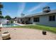 Inviting backyard with a sparkling pool, covered patio, and low-maintenance landscaping offering a perfect outdoor retreat at 3759 E Charter Oak Rd, Phoenix, AZ 85032