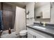 Bathroom featuring modern vanity, updated fixtures, and tiled shower/tub combo at 3759 E Charter Oak Rd, Phoenix, AZ 85032