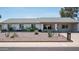 Charming single-story home featuring desert landscaping, a welcoming front porch, and a well-maintained exterior at 3759 E Charter Oak Rd, Phoenix, AZ 85032