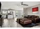 Open-concept living room with an island view, modern appliances, and lots of natural light at 3759 E Charter Oak Rd, Phoenix, AZ 85032