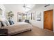 Bright bedroom featuring natural light, neutral colors and exterior access to the patio at 41503 N 109Th Pl, Scottsdale, AZ 85262