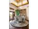 Elegant dining room with a decorative ceiling, chandelier, and views of the outdoors through the french doors at 41503 N 109Th Pl, Scottsdale, AZ 85262