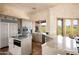 Spacious kitchen features granite counters, tiled floors, stainless appliances, recessed lighting and lots of windows for natural light at 41503 N 109Th Pl, Scottsdale, AZ 85262