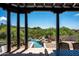 Desert view from the covered patio, overlooking the pool and desert landscape at 41503 N 109Th Pl, Scottsdale, AZ 85262