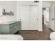 Bedroom featuring hardwood floors, closet doors, and stylish decor at 4515 E Verbena Dr, Phoenix, AZ 85044