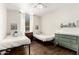 Shared bedroom offers hardwood floors, individual beds, and charming decor at 4515 E Verbena Dr, Phoenix, AZ 85044