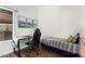 Bedroom with hardwood floors, natural light, and a desk area for work or study at 4515 E Verbena Dr, Phoenix, AZ 85044