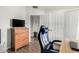 Bedroom features include hardwood floors, a TV on a dresser, and an inviting atmosphere at 4515 E Verbena Dr, Phoenix, AZ 85044