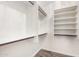Walk-in closet with ample shelving for organized storage in a clean, well-lit space at 4515 E Verbena Dr, Phoenix, AZ 85044