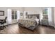 Spacious main bedroom boasts natural light, hardwood floors, and stylish furnishings at 4515 E Verbena Dr, Phoenix, AZ 85044