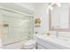 Updated bathroom featuring a modern vanity, stylish fixtures, and a shower-tub combo at 5333 E Sheena Dr, Scottsdale, AZ 85254