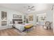 Comfortable bedroom features neutral decor, a ceiling fan, and en-suite bathroom access at 5333 E Sheena Dr, Scottsdale, AZ 85254