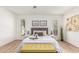 Bedroom features an upholstered headboard, stylish seating, and neutral decor at 5333 E Sheena Dr, Scottsdale, AZ 85254