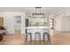 Bright open-concept kitchen area featuring a large center island, stainless appliances, and modern light fixtures at 5333 E Sheena Dr, Scottsdale, AZ 85254