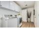 Laundry room features washer, dryer, and ample cabinet storage at 5333 E Sheena Dr, Scottsdale, AZ 85254