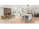 Open living space with modern fireplace, stylish seating, and a kitchen island with barstool seating at 5333 E Sheena Dr, Scottsdale, AZ 85254