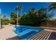 Inviting pool area with mature trees and landscaping at 5333 E Sheena Dr, Scottsdale, AZ 85254