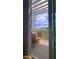 Inviting balcony with a cozy chair, decorative pillows, and a view of the surrounding landscape at 5455 E Lincoln Dr # 1004, Paradise Valley, AZ 85253