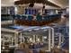 Chic bar featuring stylish blue chairs, contemporary lighting, and a sleek design at 5455 E Lincoln Dr # 1004, Paradise Valley, AZ 85253