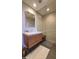 Stylish bathroom vanity with marble countertop, wooden cabinet, and glass shower enclosure at 5455 E Lincoln Dr # 1004, Paradise Valley, AZ 85253