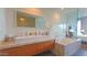 Spa bathroom with a large sink, marble countertops, and seamless glass shower enclosure at 5455 E Lincoln Dr # 1004, Paradise Valley, AZ 85253