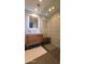 Modern bathroom with wood vanity, lighted mirror, glass shower, and neutral colors at 5455 E Lincoln Dr # 1004, Paradise Valley, AZ 85253
