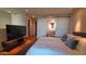Beautiful bedroom with hardwood floors, large bed, and a bathroom with modern vanity at 5455 E Lincoln Dr # 1004, Paradise Valley, AZ 85253
