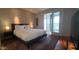 Cozy bedroom featuring large bed, area rug, bedside lamps, and natural light at 5455 E Lincoln Dr # 1004, Paradise Valley, AZ 85253