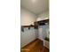 A modern closet features wood shelves and a hanging rod, offering organized storage space in a well-lit room at 5455 E Lincoln Dr # 1004, Paradise Valley, AZ 85253