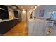 Modern kitchen featuring stainless steel appliances, stone countertops, and open layout to the dining area at 5455 E Lincoln Dr # 1004, Paradise Valley, AZ 85253